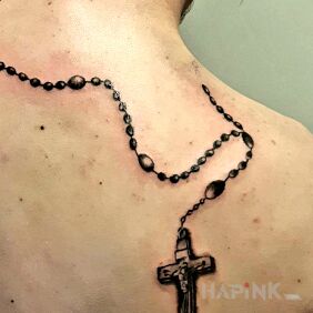 Tattoo Religious on the back motif: objects style: realistic