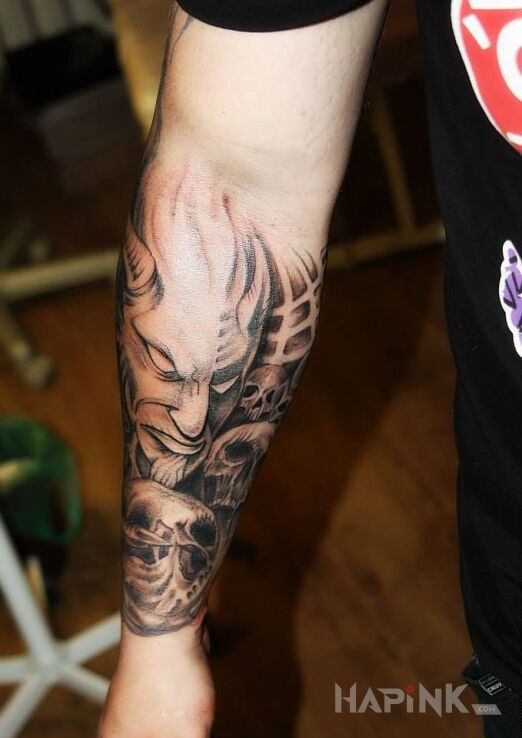 Tattoo Diabeł in demons motif on the forearm