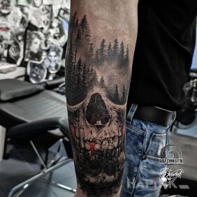 Tattoo Skull in the forest on the forearm motif: skulls style: realistic