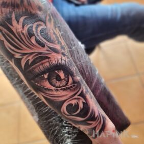 Tattoo The third eye is always watching on the forearm motif: black and gray style: realistic
