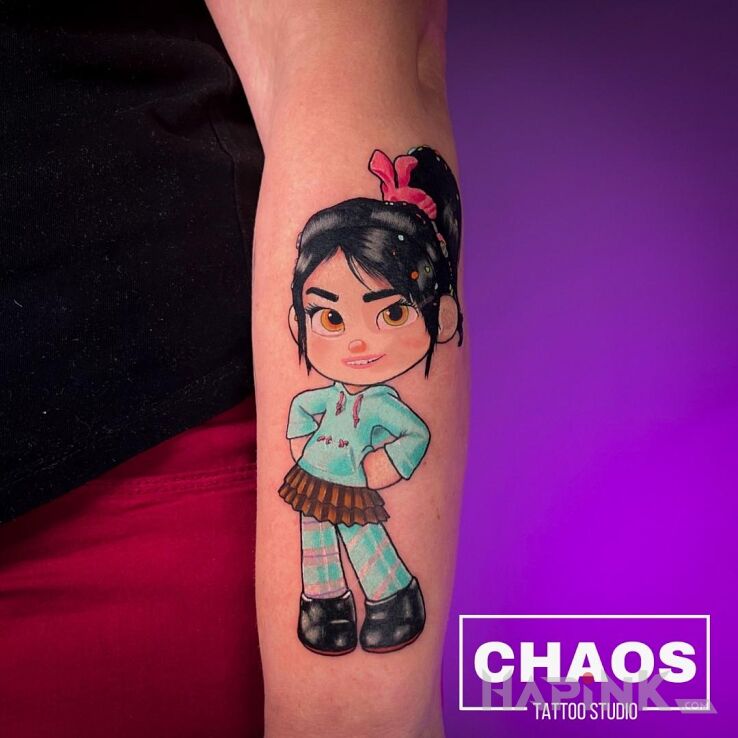 Tattoo Vandellope Raph Demolka in colorful motif and cartoon / comic book style on the forearm