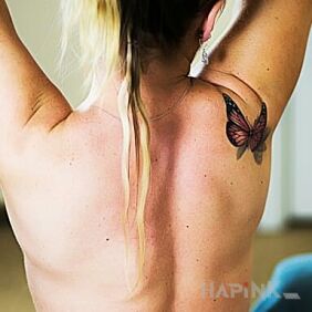 Tattoo First and honest. on the shoulder blades motif: butterflies