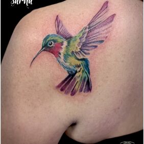 Tattoo Colorful bird tattoo on the back motif: animals style: realistic