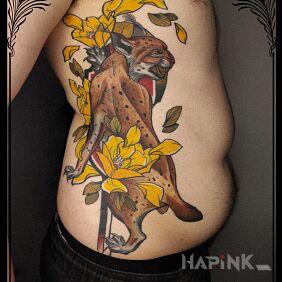 Tattoo Healed lynx on the ribs motif: colorful style: neo-traditional