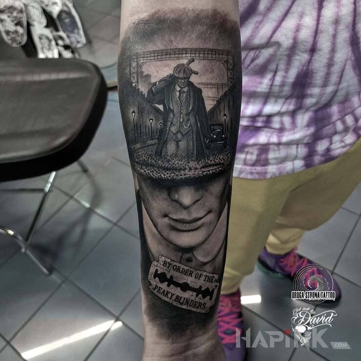 Tattoo Peaky Blinders in faces motif and realistic style on the forearm