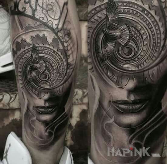 Tattoo Wir in faces motif on the calf