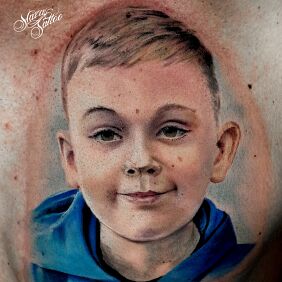 Tattoo Son portrait tattoo on the chest motif: colorful style: realistic