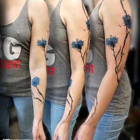 Tattoo Cornflowers on the forearm motif: flowers style: realistic