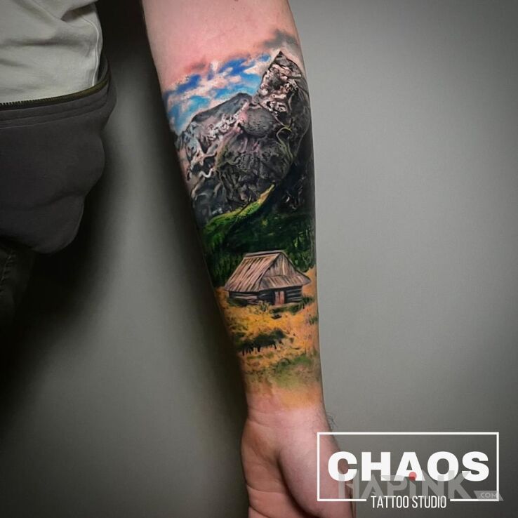 Tattoo Wyjechać w Bieszczady in nature motif and realistic style On the arm