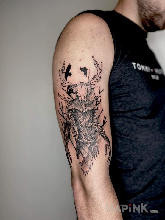 Tattoo Leszy, wiedźmin in black and gray motif and graphic / illustrative style On the arm
