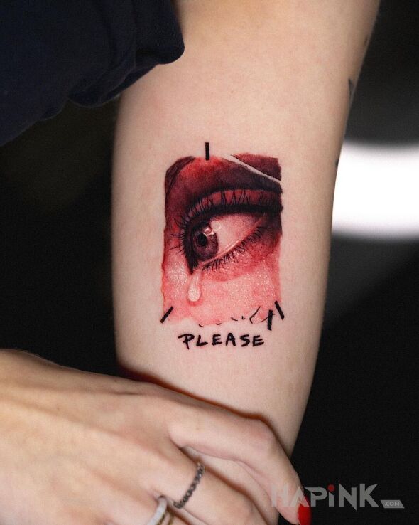 Tattoo Please in colorful motif and realistic style On the arm