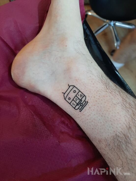 Tattoo Pierwsza mikolska dziara in black and gray motif and contour / linework style near the ankle