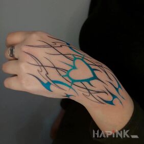 Tattoo Blue heart On the arm motif: colorful