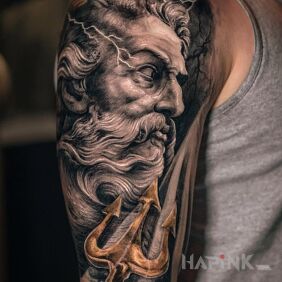 Tattoo Poseidon on the upper arm motif: faces