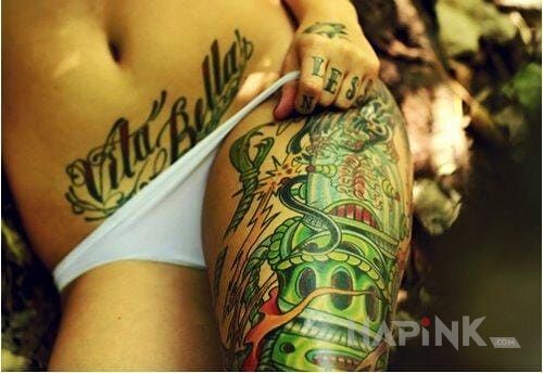 Tattoo Napis na brzuchu in lettering motif on the stomach