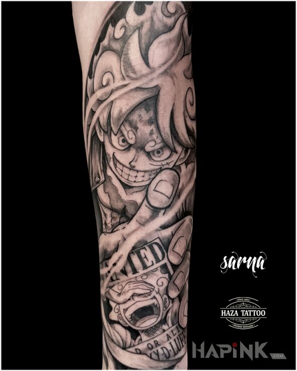 Tattoo Anime luffy tattoo in black and gray motif and graphic / illustrative style on the forearm