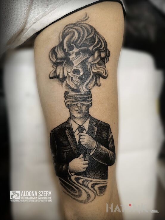 Tattoo Abstrakcyjny człowiek in dark motif and dotwork style on the bicep