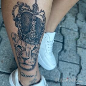 Tattoo Lion on the tibia motif: animals style: realistic