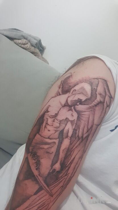 Tattoo Angel in characters motif and graphic / illustrative style on the upper arm