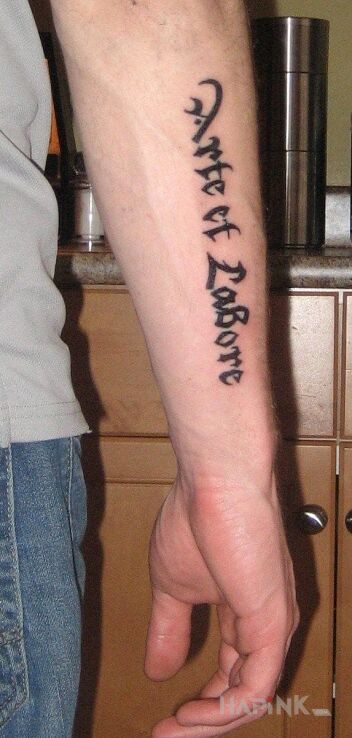 Tattoo Lacina in lettering motif on the forearm