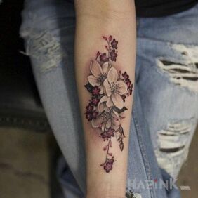 Tattoo White flower on the forearm motif: flowers style: realistic
