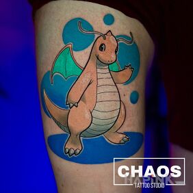 Tattoo Dragonite Pokemon on the thigh motif: colorful style: cartoon / comic book