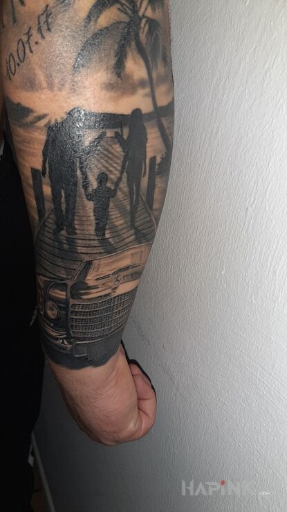 Tattoo Rodzina in black and gray motif and realistic style On the arm