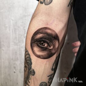 Tattoo What am I looking at! on the forearm motif: black and gray style: realistic