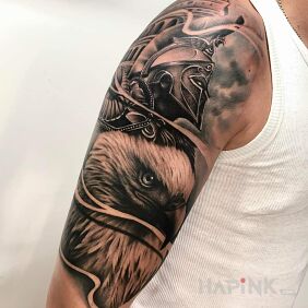 Tattoo Spartacus on the upper arm motif: faces style: realistic