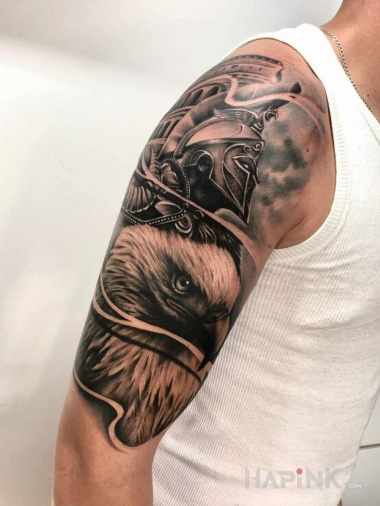Tattoo Spartacus in black and gray motif and realistic style on the upper arm