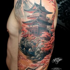 Tattoo Color temple tattoo on the upper arm motif: floral style: realistic