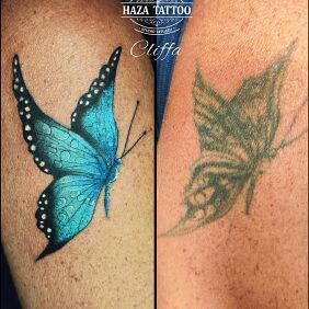 Tattoo Butterfly cover tattoo on the upper arm motif: cover-up style: realistic