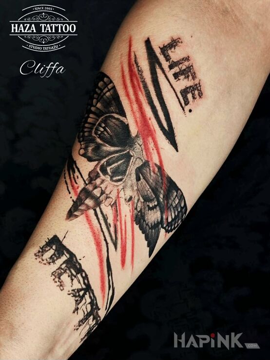 Tattoo Life death color tattoo in skulls motif and trash polka style On the arm