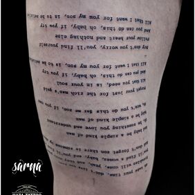 Tattoo Tattoo text on the thigh motif: lettering style: calligraphy