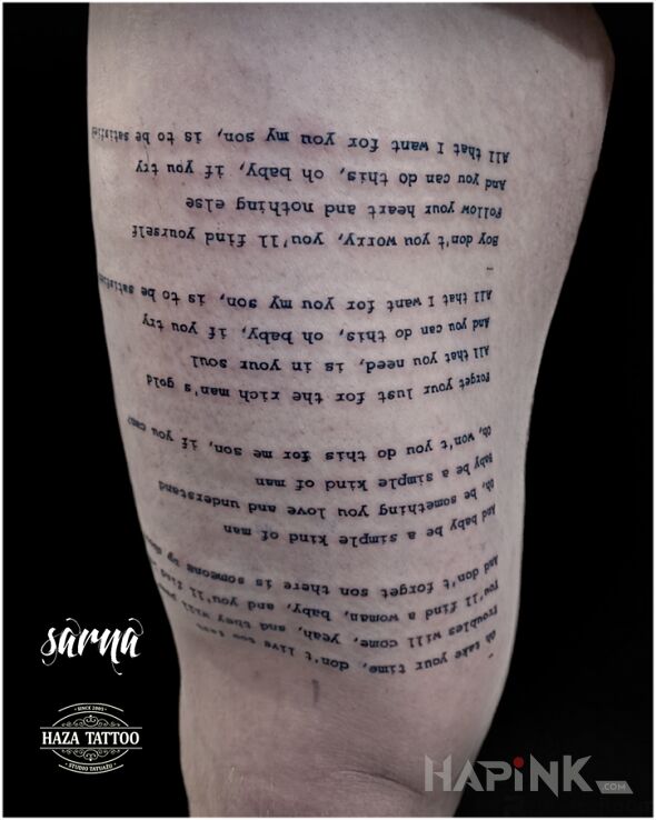 Tattoo Tattoo text in lettering motif and calligraphy style on the thigh