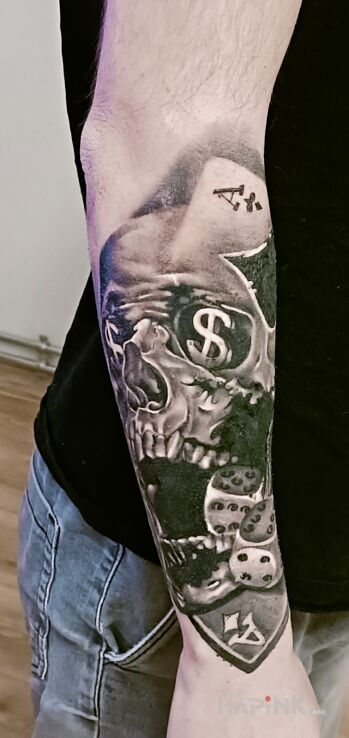 Tattoo Mój tatuaż in skulls motif and realistic style on the forearm