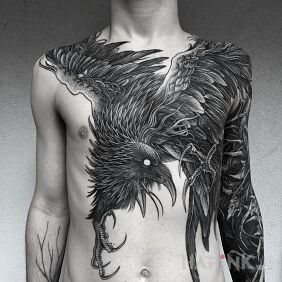 Tattoo Big black bird on the collarbone motif: black and gray style: graphic / illustrative