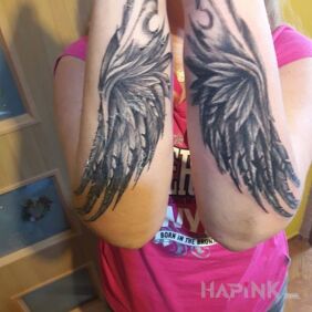 Tattoo Wings on the forearm motif: angels