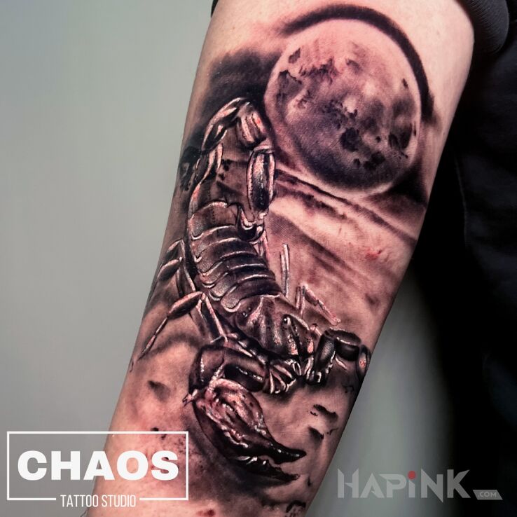 Tattoo Scorpio moon in black and gray motif and realistic style on the forearm