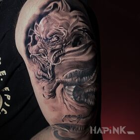 Tattoo Chinese dragon on the upper arm motif: black and gray style: realistic