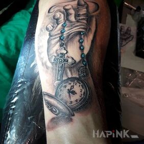 Tattoo Hand on the forearm motif: religious