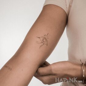 Tattoo Egyptian eye on the bicep motif: other style: minimalistic