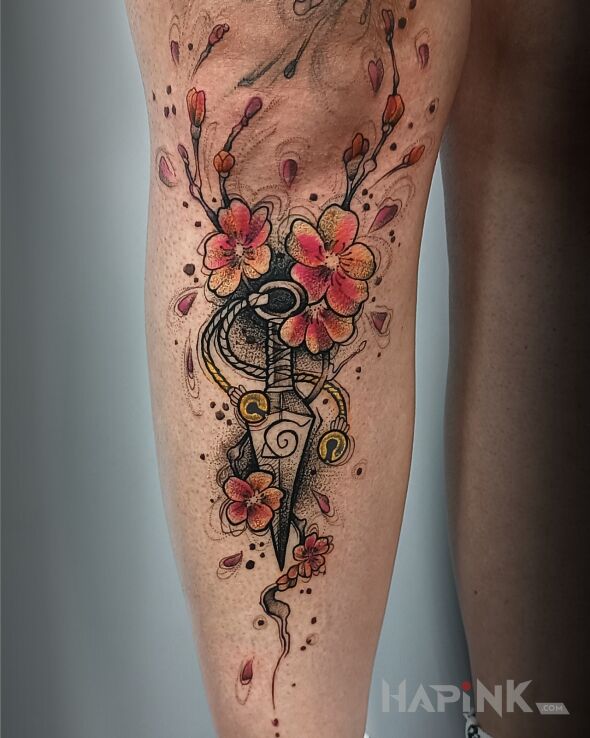 Tattoo Manga. Sztylet w kwiatach wiśni. in colorful motif and graphic / illustrative style on the tibia