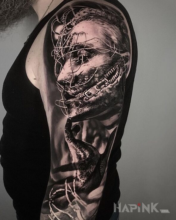 Tattoo Milczenie in black and gray motif and realistic style On the arm