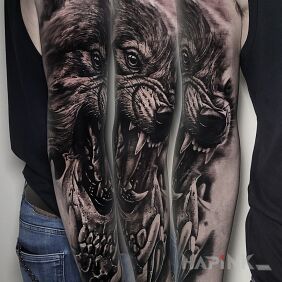 Tattoo Little Wolf on the upper arm motif: skulls style: realistic