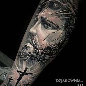 Tatuaż Jezus w szarościach na piszczeli motyw: twarze styl: realistyczne