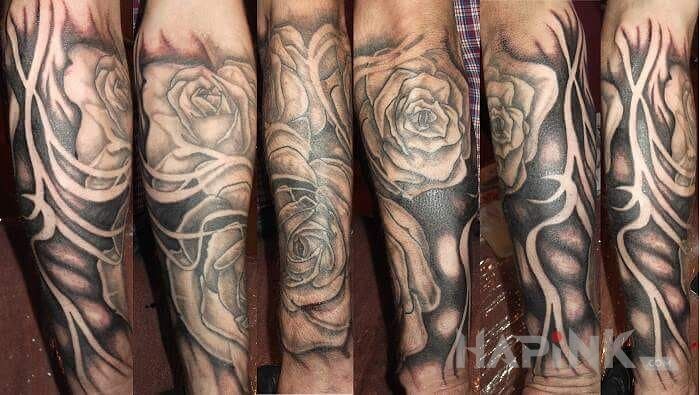 Tattoo Roże in flowers motif on the forearm