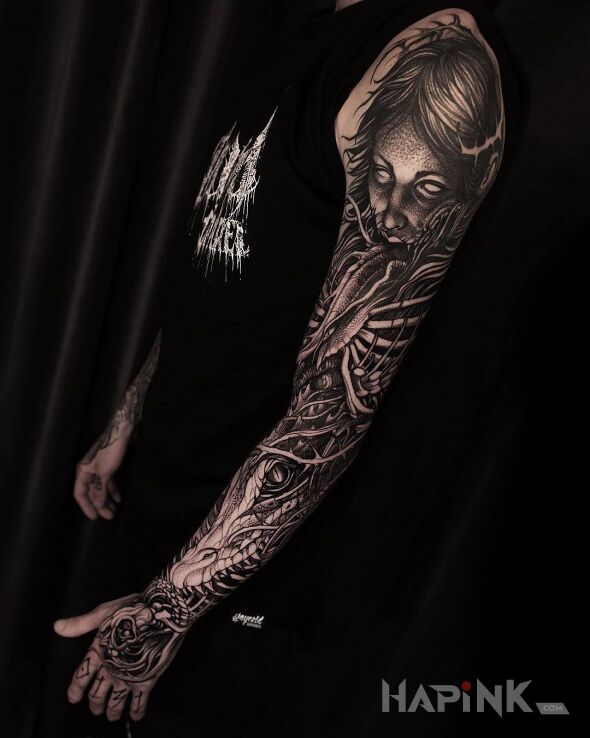 Tattoo Wstąp w mrok in dark motif and graphic / illustrative style on the hand