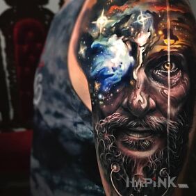 Tattoo Dziadyga on the upper arm motif: cosmos style: realistic