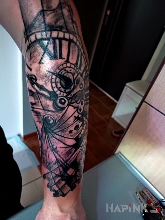 Tattoo Zegar mapa in black and gray motif and graphic / illustrative style On the arm